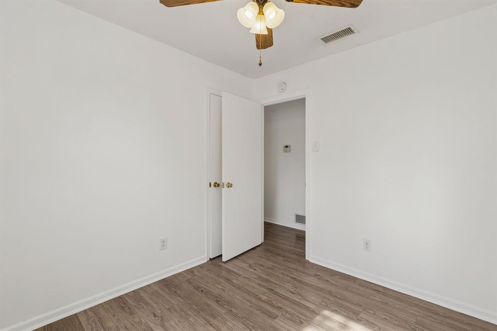 1822 Finley Road Irving, TX 75062 - Photo 26 of 38 a view of an empty room with a chandelier fan