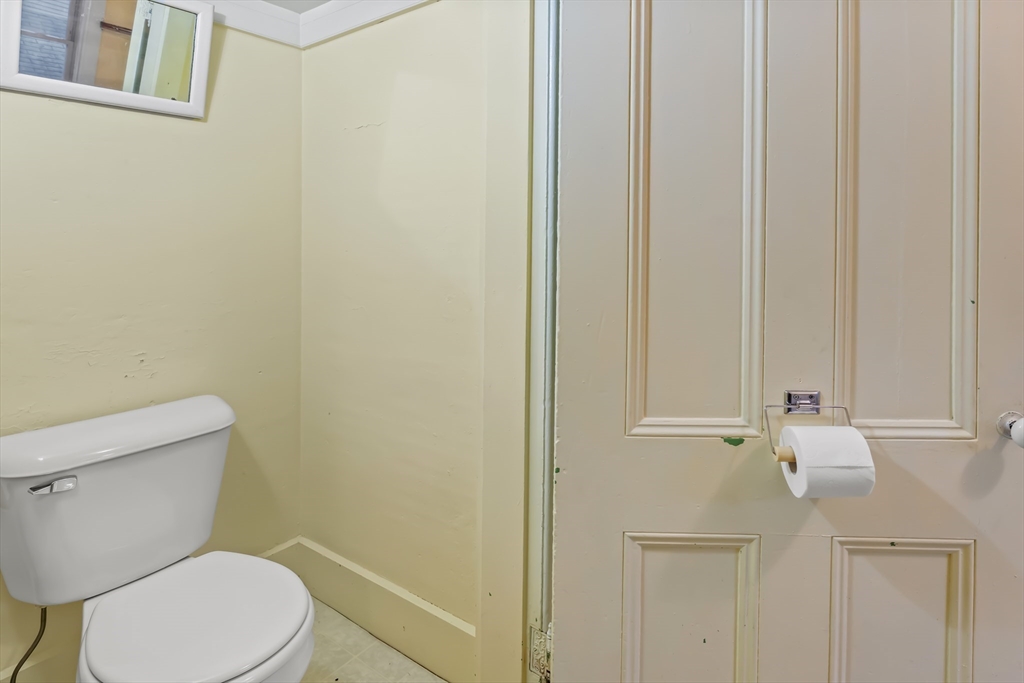 216 Walnut Street Clinton, MA 01510 - Photo 12 of 40 a white toilet sitting next to a shower