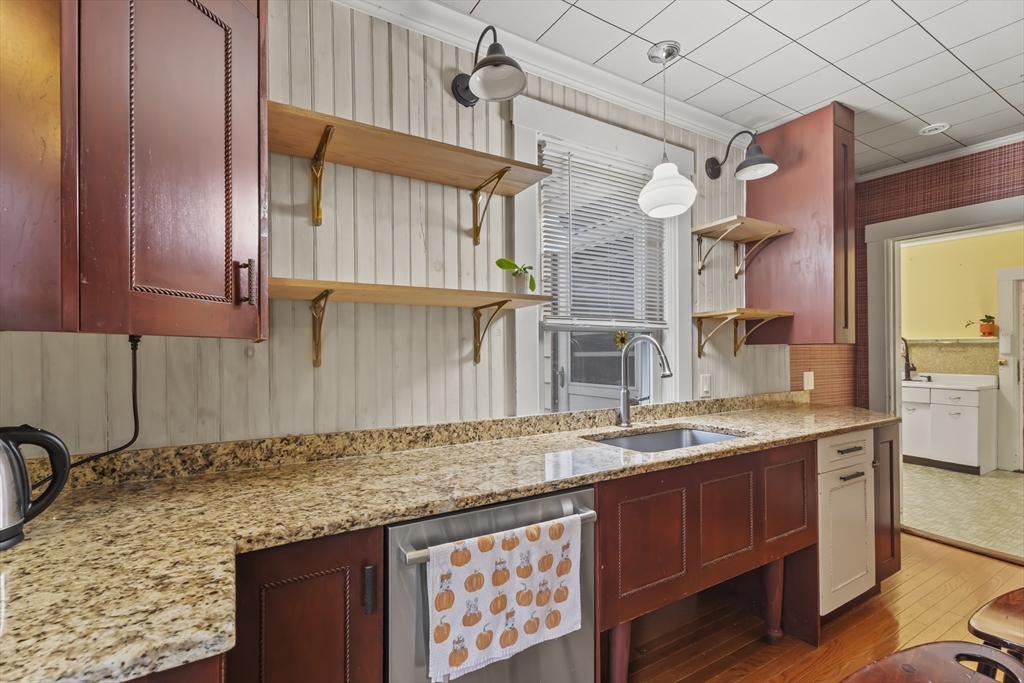 216 Walnut Street Clinton, MA 01510 - Photo 16 of 40 a bathroom with a granite countertop sink and a mirror