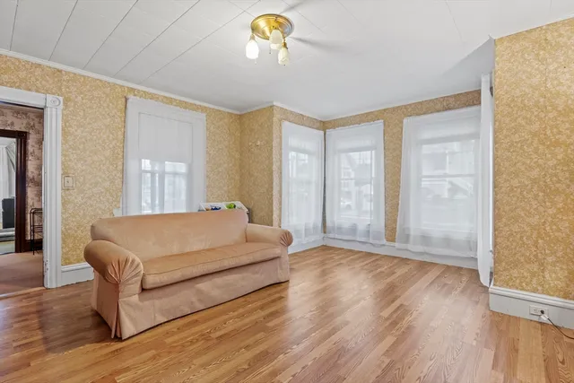 a spacious bedroom with a bed and window