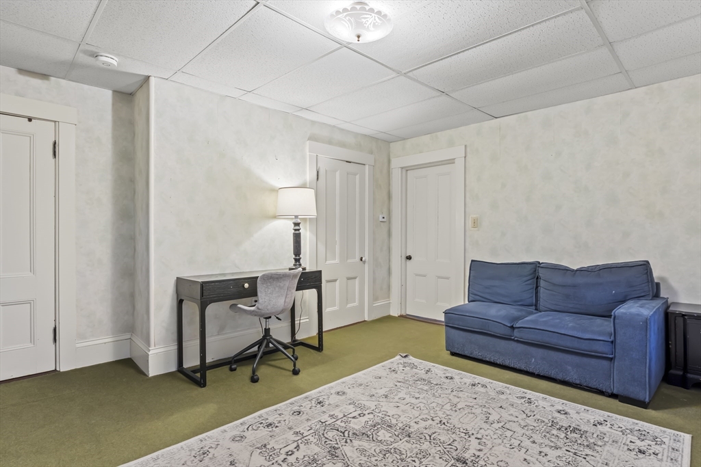 216 Walnut Street Clinton, MA 01510 - Photo 22 of 40 a living room with furniture and a rug