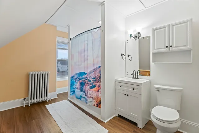 a bathroom with a toilet a sink and a bathtub