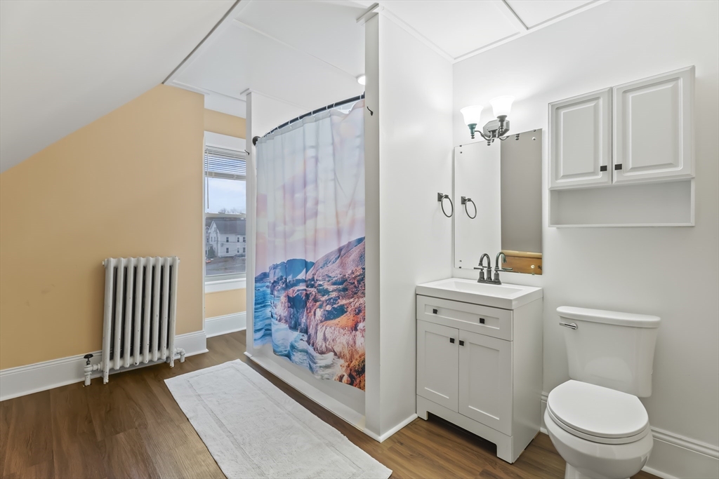 216 Walnut Street Clinton, MA 01510 - Photo 23 of 40 a bathroom with a toilet a sink and a bathtub