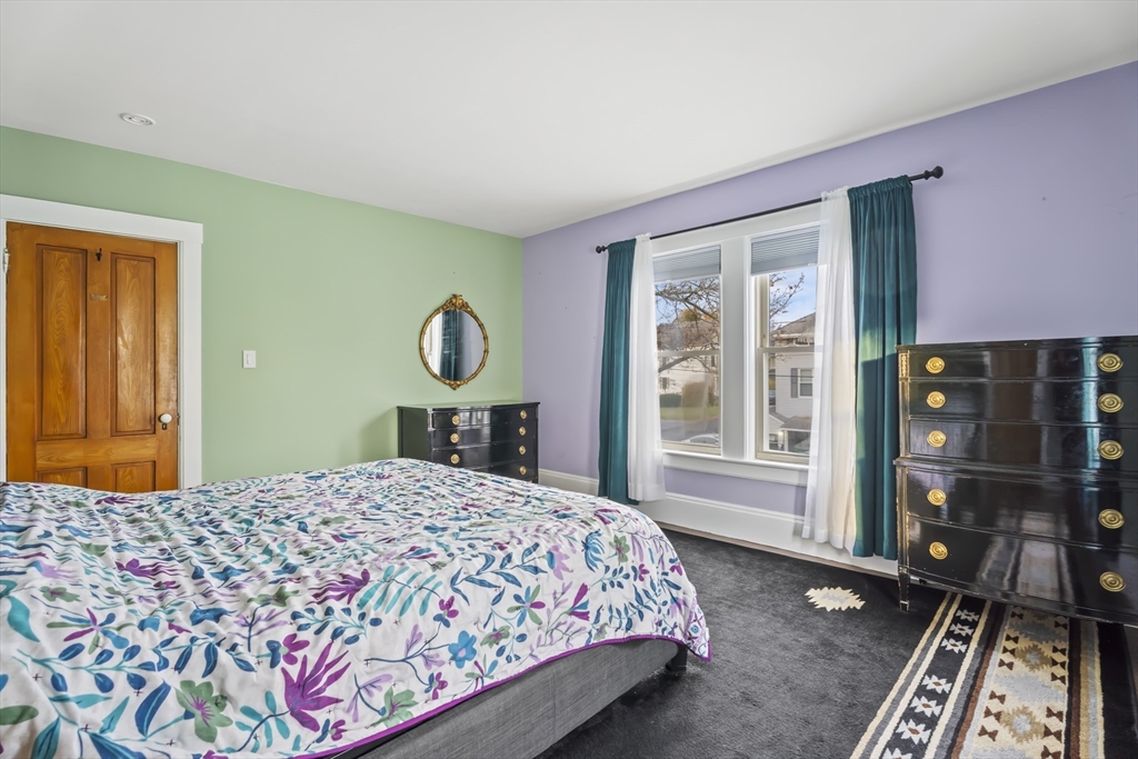 216 Walnut Street Clinton, MA 01510 - Photo 25 of 40 a bedroom with a bed dresser and a window