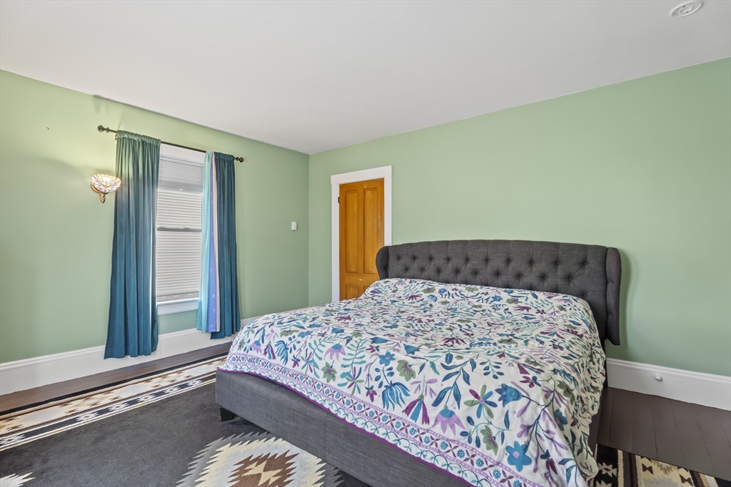 216 Walnut Street Clinton, MA 01510 - Photo 27 of 40 a bedroom with a bed and a window