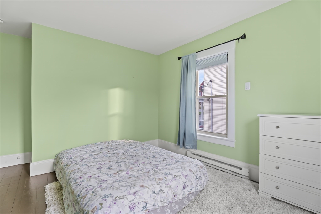 216 Walnut Street Clinton, MA 01510 - Photo 28 of 40 a bedroom with a bed and a window