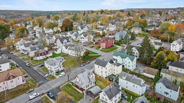 an aerial view of residential building with parking