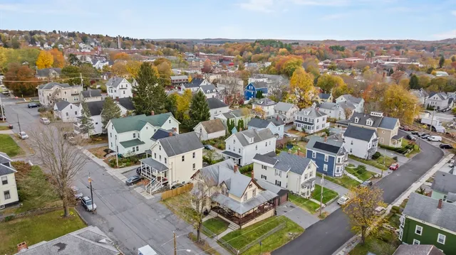an aerial view of residential houses with outdoor space