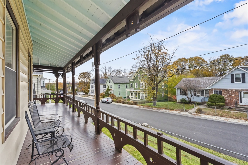 216 Walnut Street Clinton, MA 01510 - Photo 6 of 40 a view of a patio with dining table and chairs