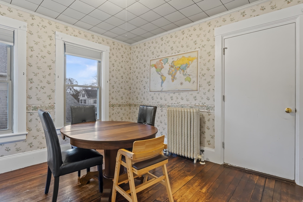216 Walnut Street Clinton, MA 01510 - Photo 9 of 40 a view of a dining room with furniture and wooden floor