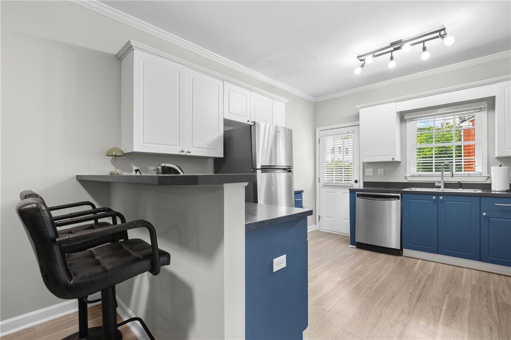 3675 Peachtree Road Northeast, Unit 45 Atlanta, GA 30319 - Photo 10 of 42 a kitchen with a refrigerator and a stove top oven