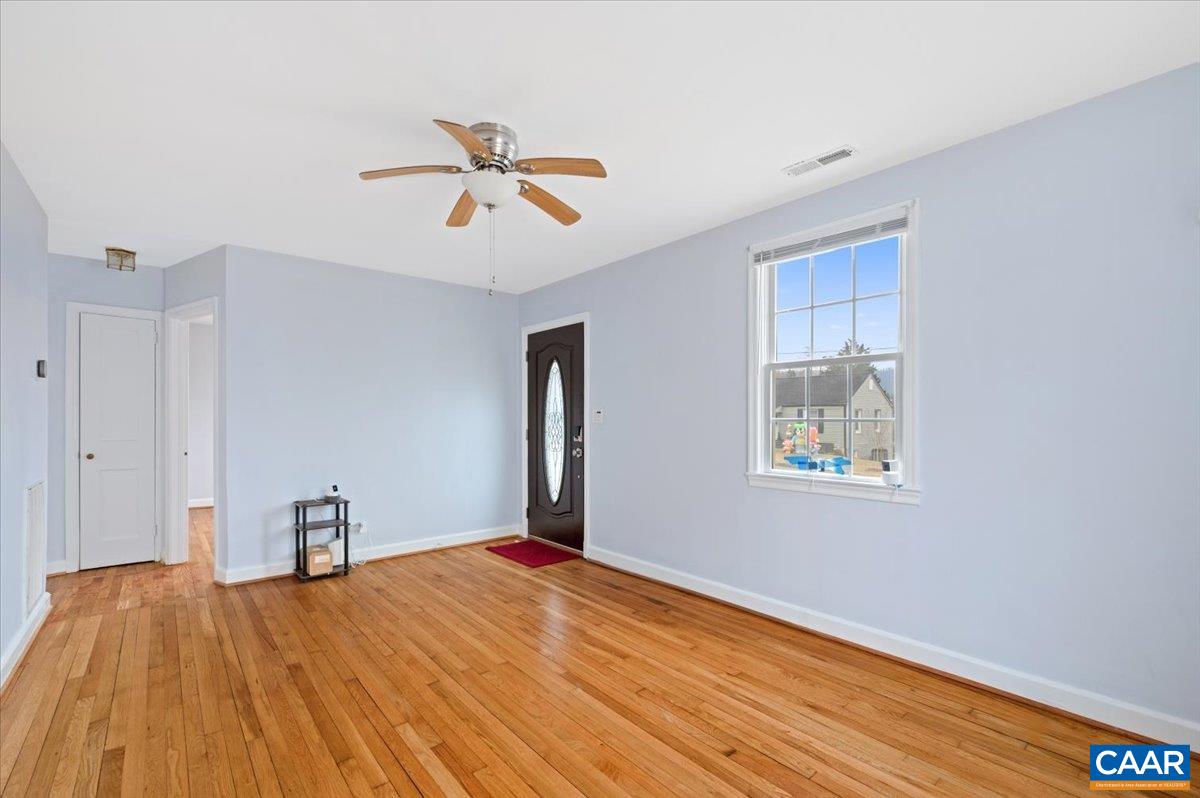 915 Altavista Avenue Charlottesville, VA 22902 - Photo 3 of 9 a view of empty room with wooden floor and fan