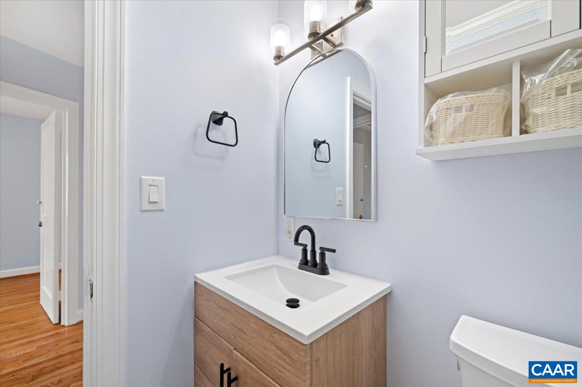 915 Altavista Avenue Charlottesville, VA 22902 - Photo 7 of 9 a bathroom with a sink mirror and toilet