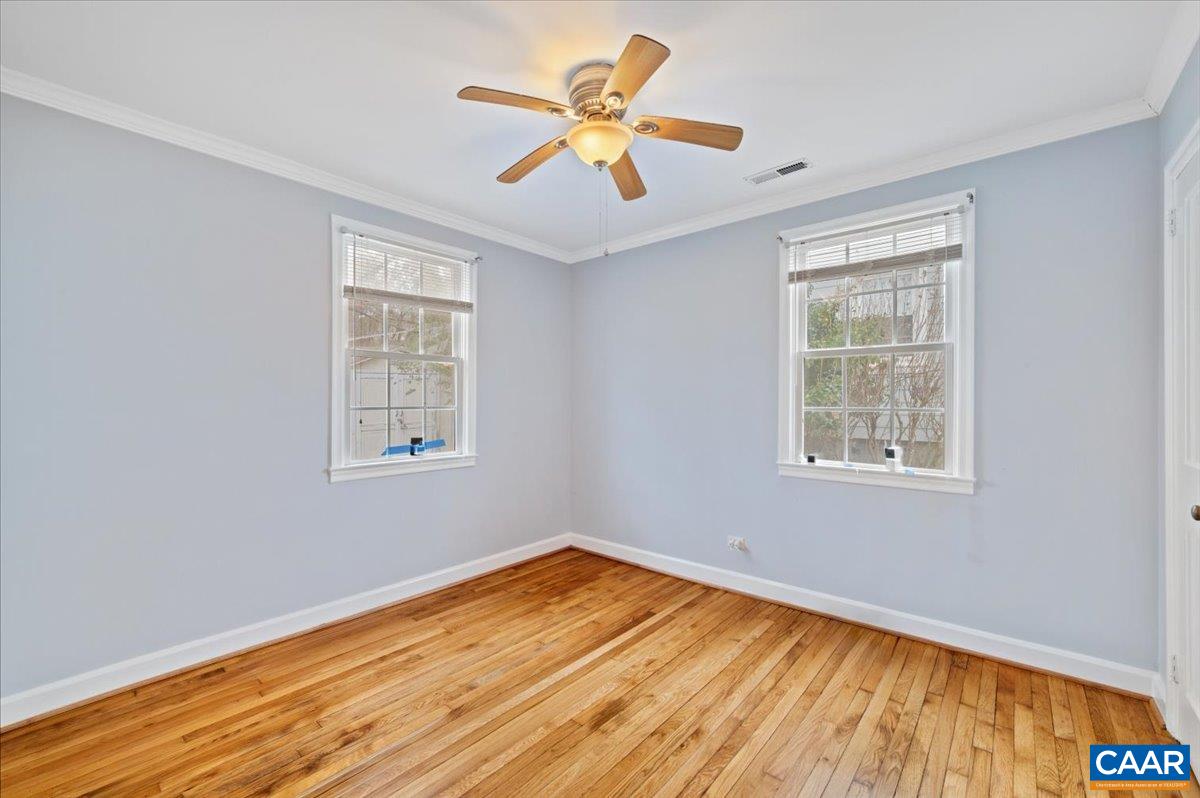 915 Altavista Avenue Charlottesville, VA 22902 - Photo 8 of 9 a view of an empty room with window and wooden floor