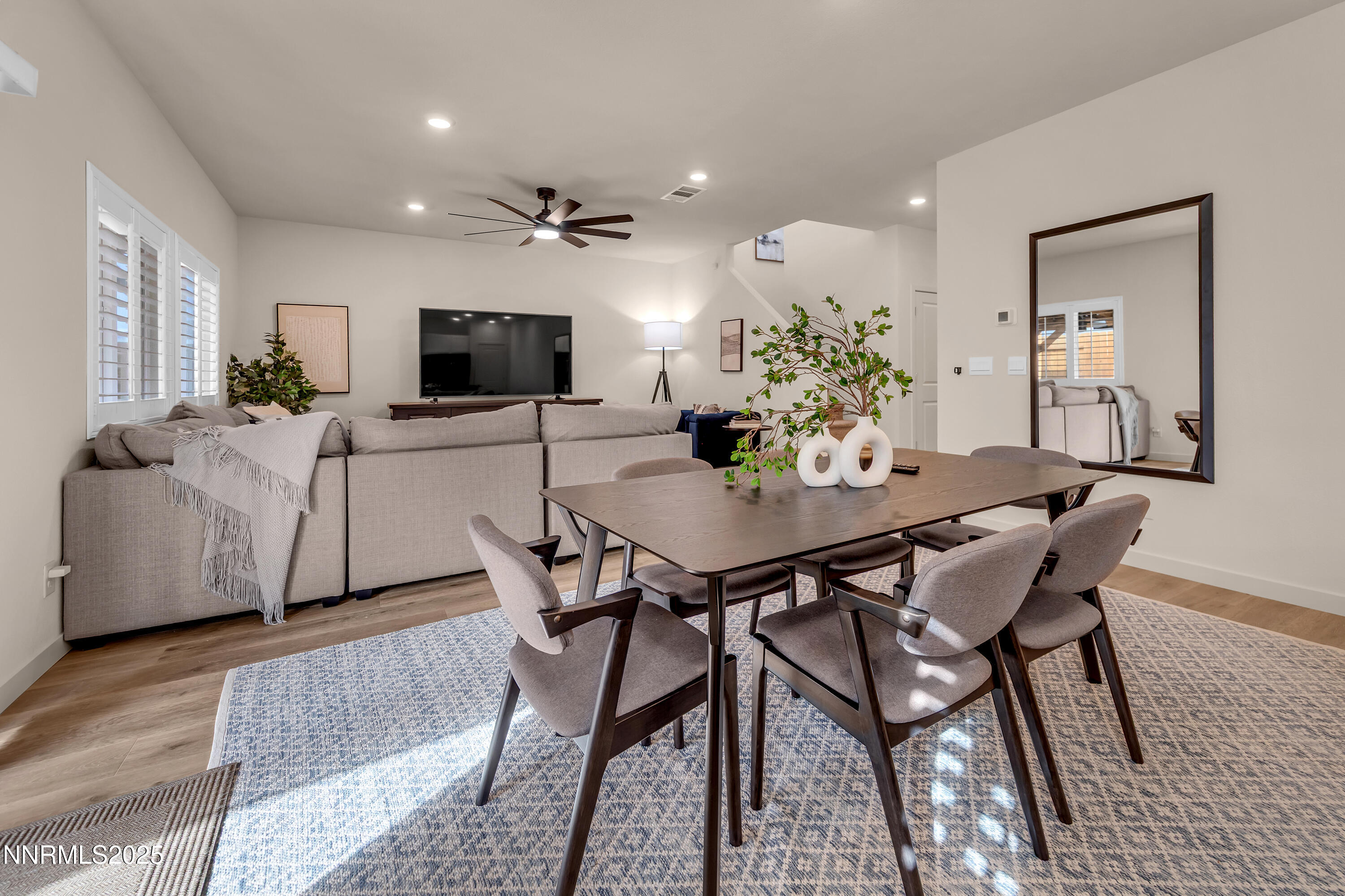 7754 Wandering Way Reno, NV 89506 - Photo 12 of 37 a view of a dining room with furniture and wooden floor
