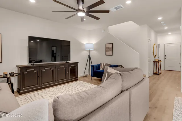 a bed room with a bed and a television