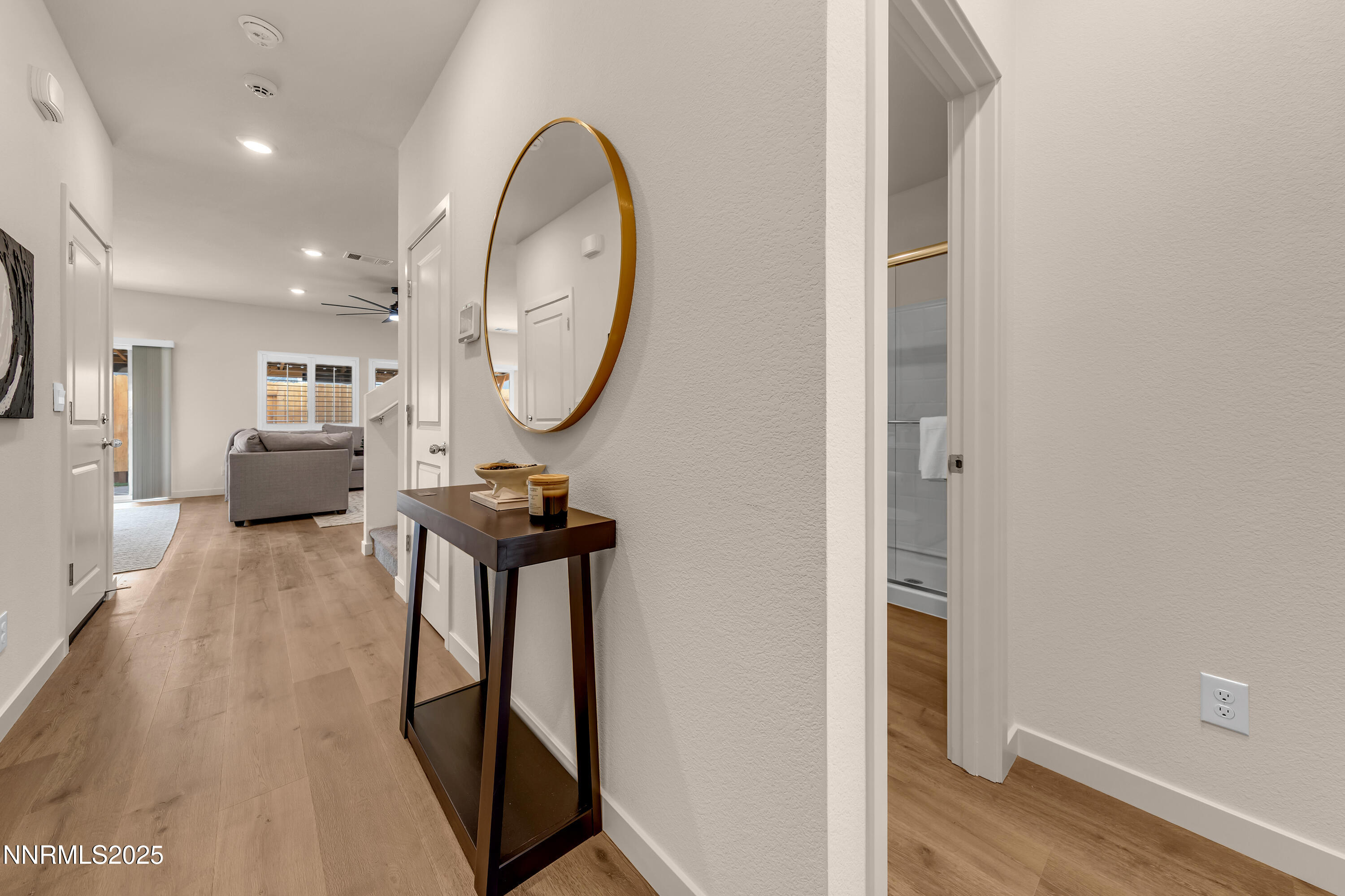 7754 Wandering Way Reno, NV 89506 - Photo 19 of 37 wooden floor with view of living room and wooden floor