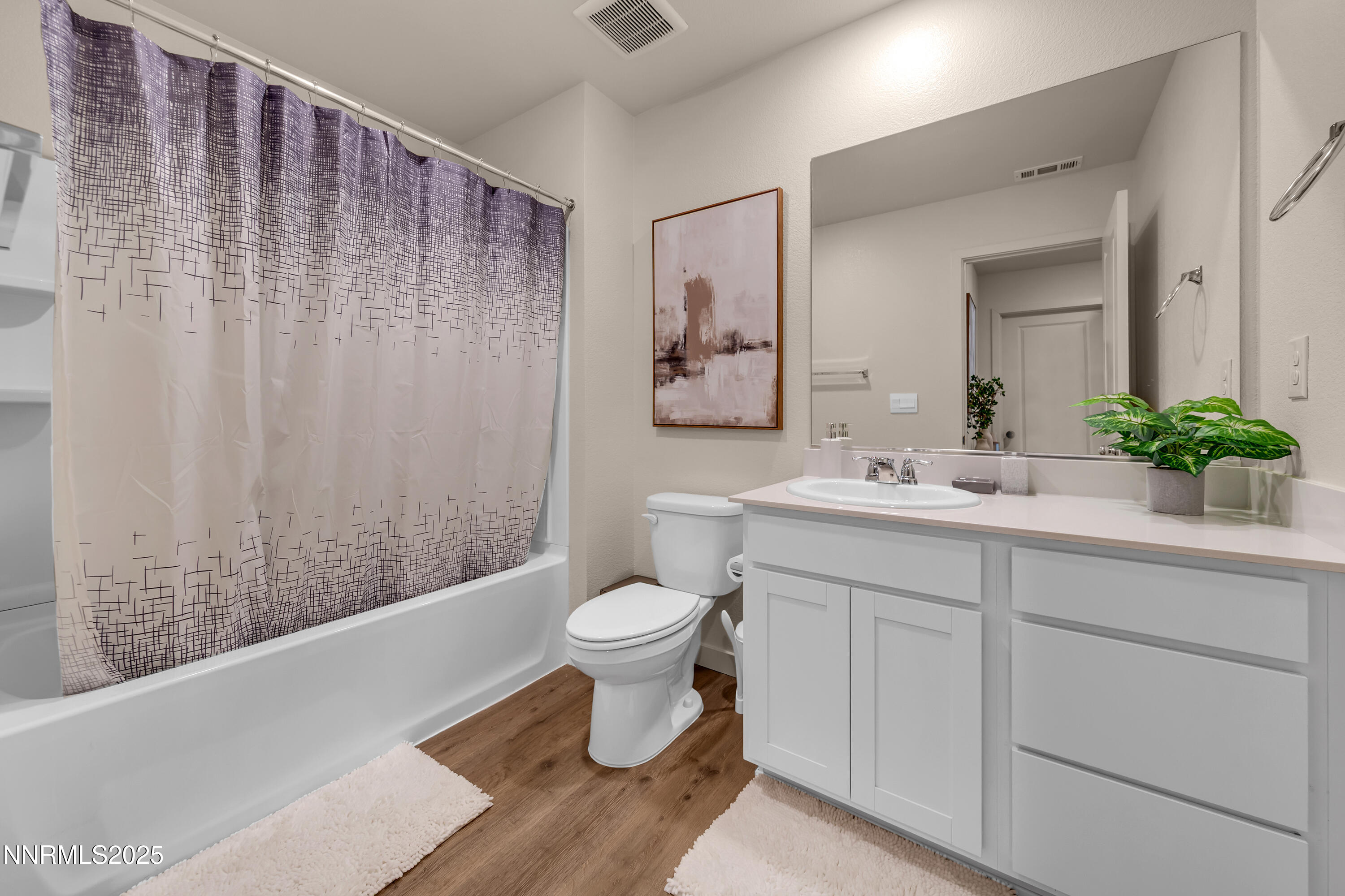 7754 Wandering Way Reno, NV 89506 - Photo 20 of 37 a bathroom with a sink toilet and shower