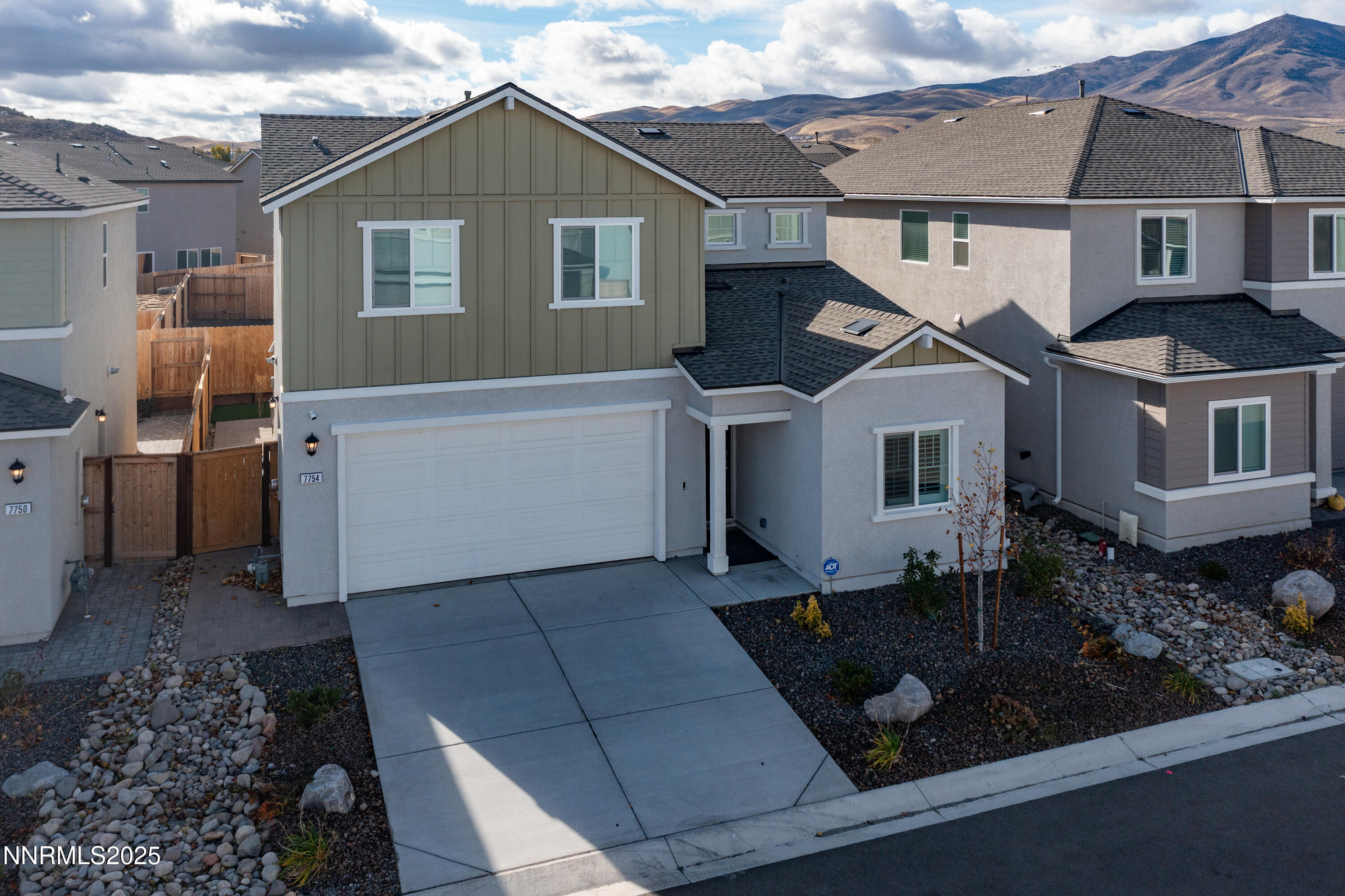 7754 Wandering Way Reno, NV 89506 - Photo 2 of 37 a front view of a house with windows
