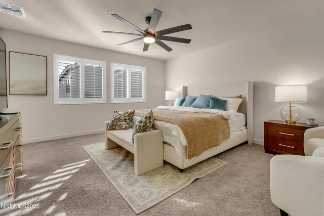 a bedroom with a bed and a couch