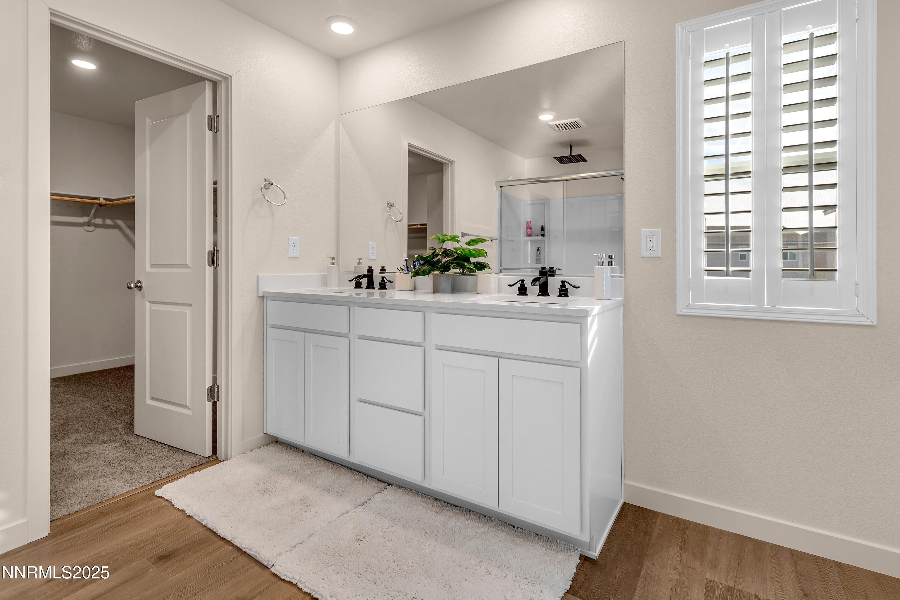 7754 Wandering Way Reno, NV 89506 - Photo 26 of 37 a bathroom with a sink and a mirror