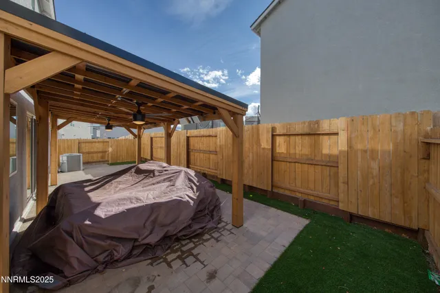 a bed sitting in a bedroom next to a yard