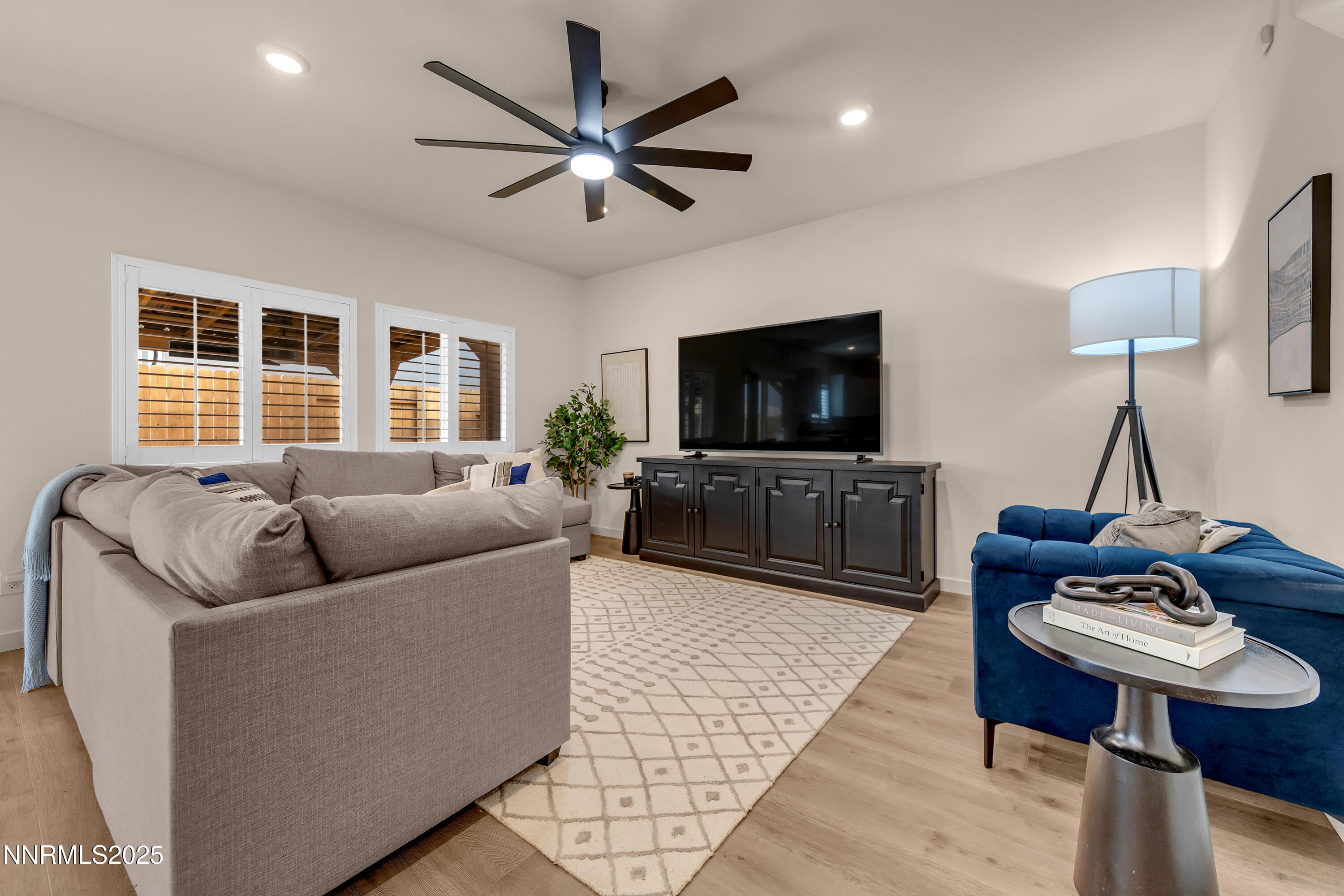 7754 Wandering Way Reno, NV 89506 - Photo 5 of 37 a living room with furniture and a flat screen tv