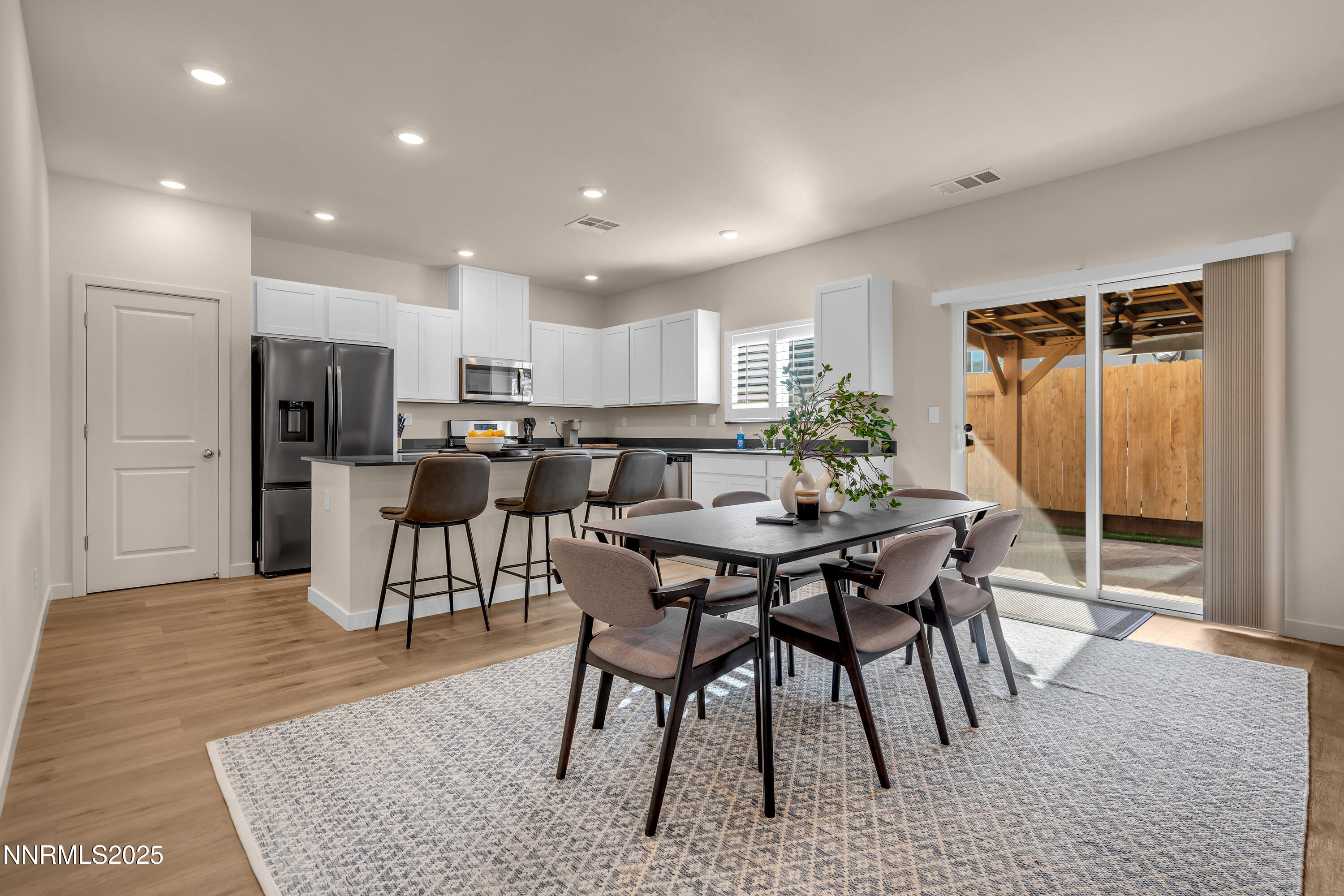 7754 Wandering Way Reno, NV 89506 - Photo 6 of 37 a view of a dining room with furniture
