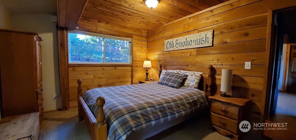 4825 Lerch Road Snohomish, WA 98290 - Photo 17 of 32 a bedroom with a bed and wooden floor