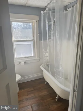 a bathroom with a bathtub and a shower