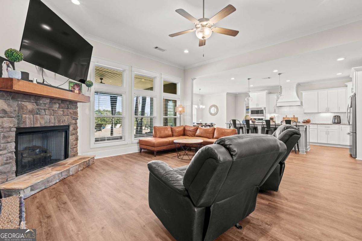 1515 Pleasant Ridge Road Carrollton, GA 30117 - Photo 14 of 72 a living room with furniture a flat screen tv and a fireplace