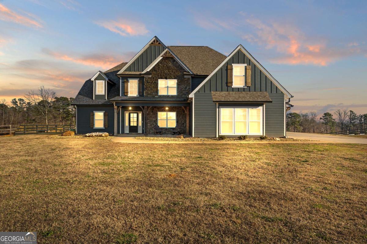 1515 Pleasant Ridge Road Carrollton, GA 30117 - Photo 2 of 72 a front view of a house with a yard
