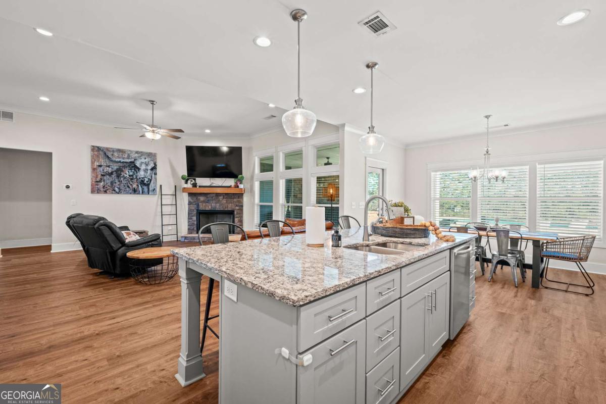 1515 Pleasant Ridge Road Carrollton, GA 30117 - Photo 22 of 72 a large kitchen with kitchen island a large island in the center