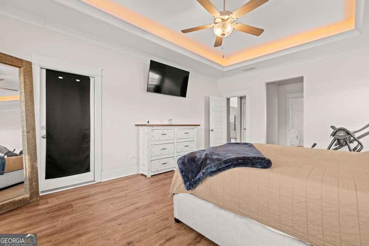 1515 Pleasant Ridge Road Carrollton, GA 30117 - Photo 26 of 72 a bedroom with a bed and a flat screen tv