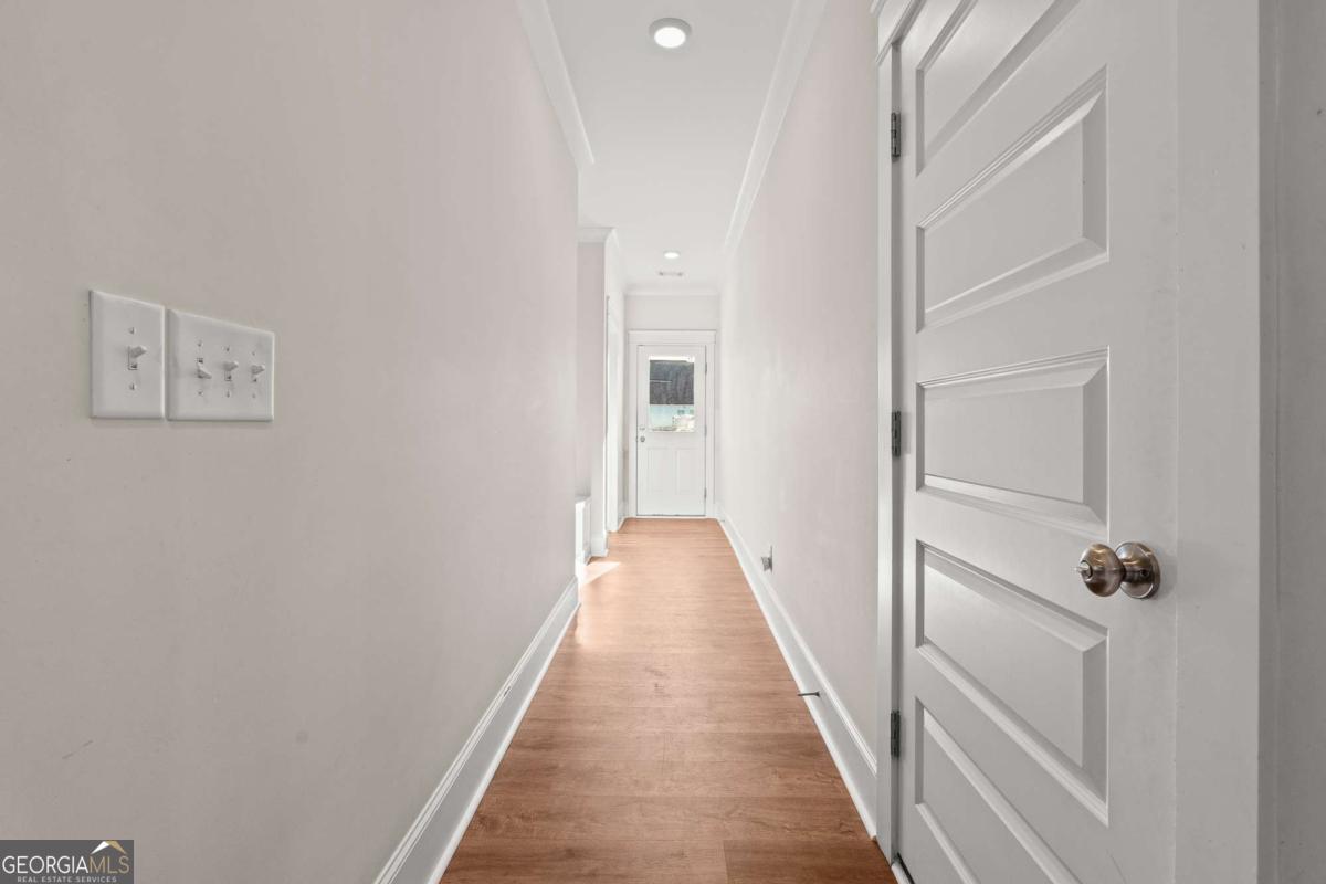 1515 Pleasant Ridge Road Carrollton, GA 30117 - Photo 34 of 72 a view of a hallway with wooden floor and entryway