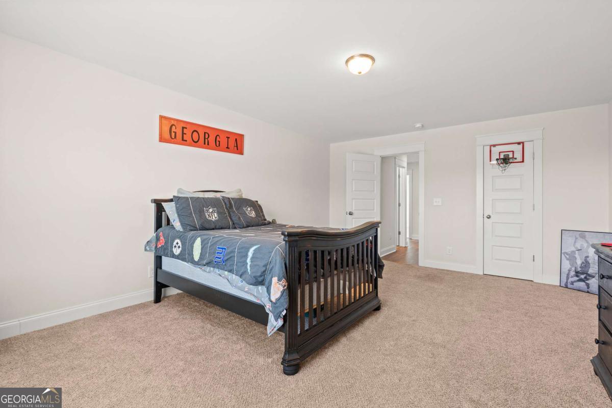 1515 Pleasant Ridge Road Carrollton, GA 30117 - Photo 46 of 72 a bedroom with a bed and a window