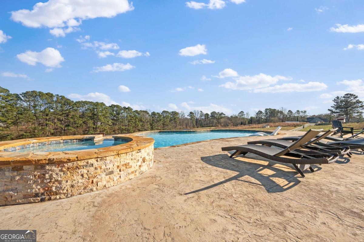 1515 Pleasant Ridge Road Carrollton, GA 30117 - Photo 51 of 72 a view of a lake with beach