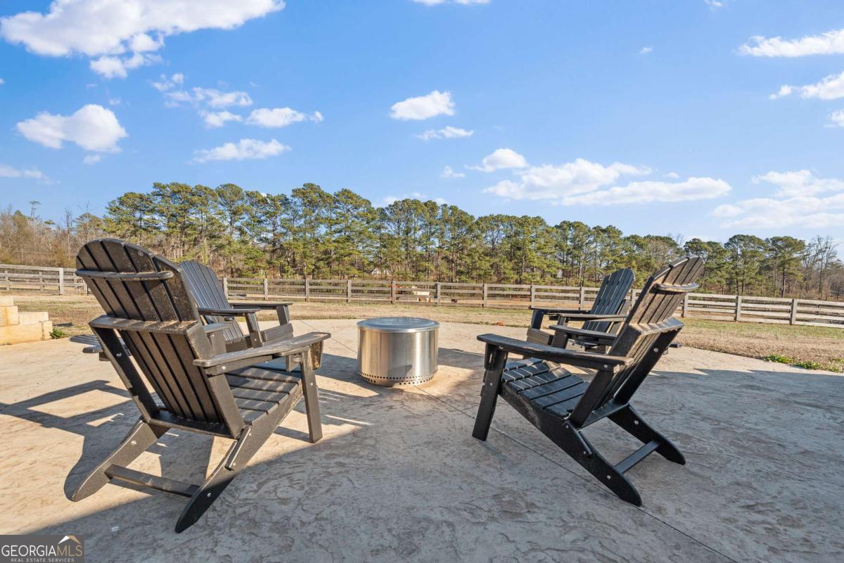 1515 Pleasant Ridge Road Carrollton, GA 30117 - Photo 57 of 72 a view of a terrace with sitting area