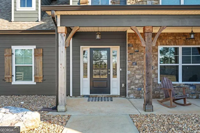 a view of entryway with wooden floor and stairs