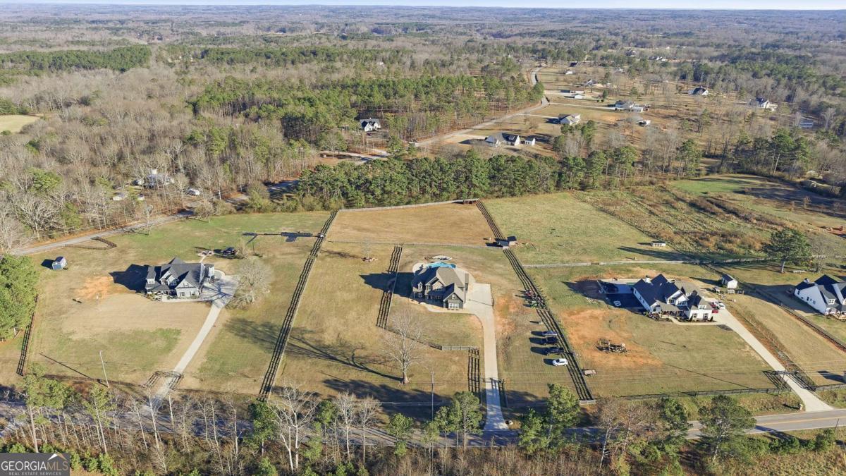 1515 Pleasant Ridge Road Carrollton, GA 30117 - Photo 71 of 72 an aerial view of a house with a yard