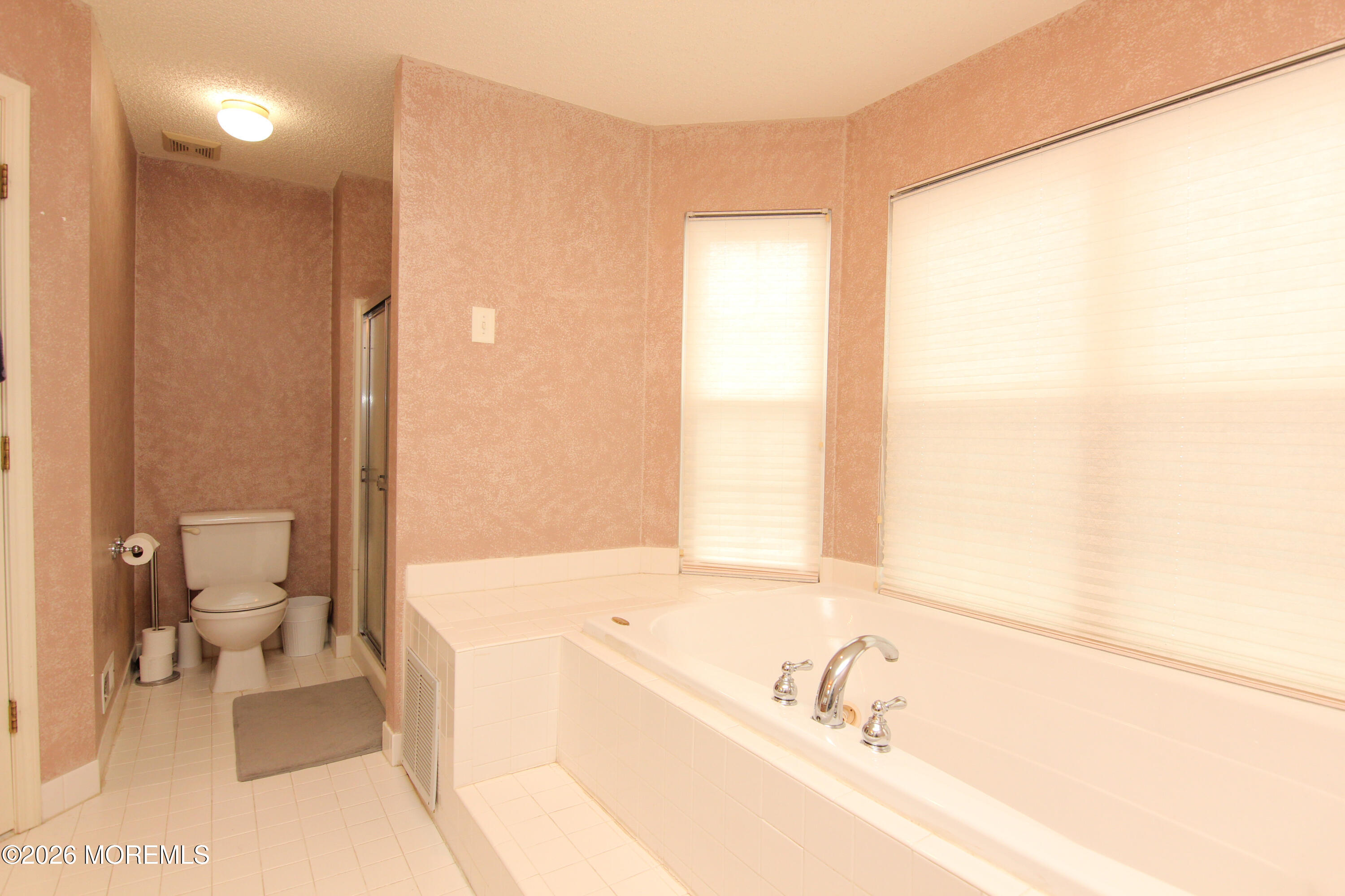 33 Austin Street Tinton Falls, NJ 07712 - Photo 10 of 46 a bathroom with a bathtub and a toilet