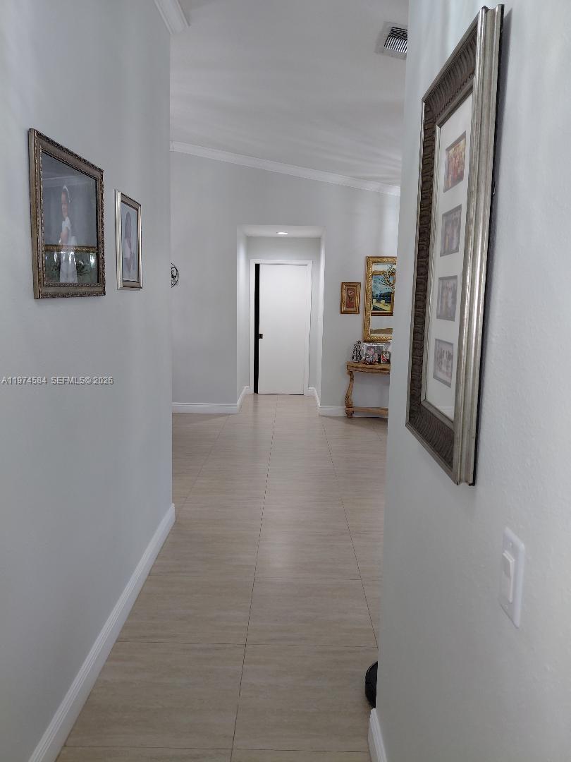 15630 Southwest 146th Avenue Miami, FL 33177 - Photo 14 of 23 a furnished livingroom with a window