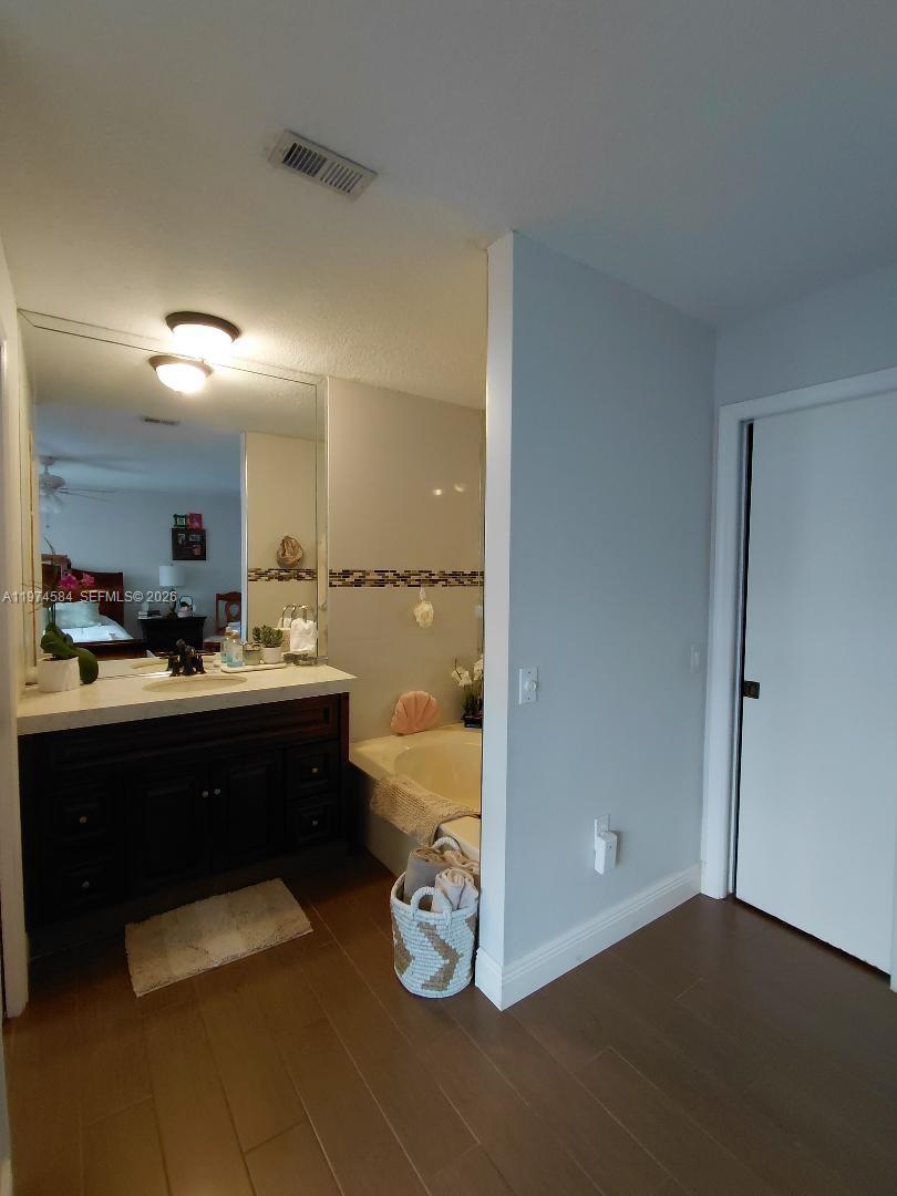 15630 Southwest 146th Avenue Miami, FL 33177 - Photo 16 of 23 a view of a living room and dining room