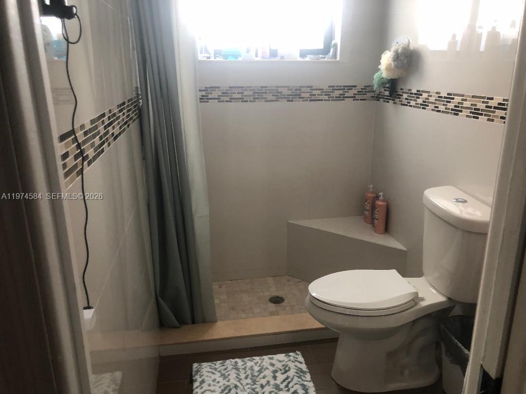 15630 Southwest 146th Avenue Miami, FL 33177 - Photo 17 of 23 a bathroom with a toilet and a shower