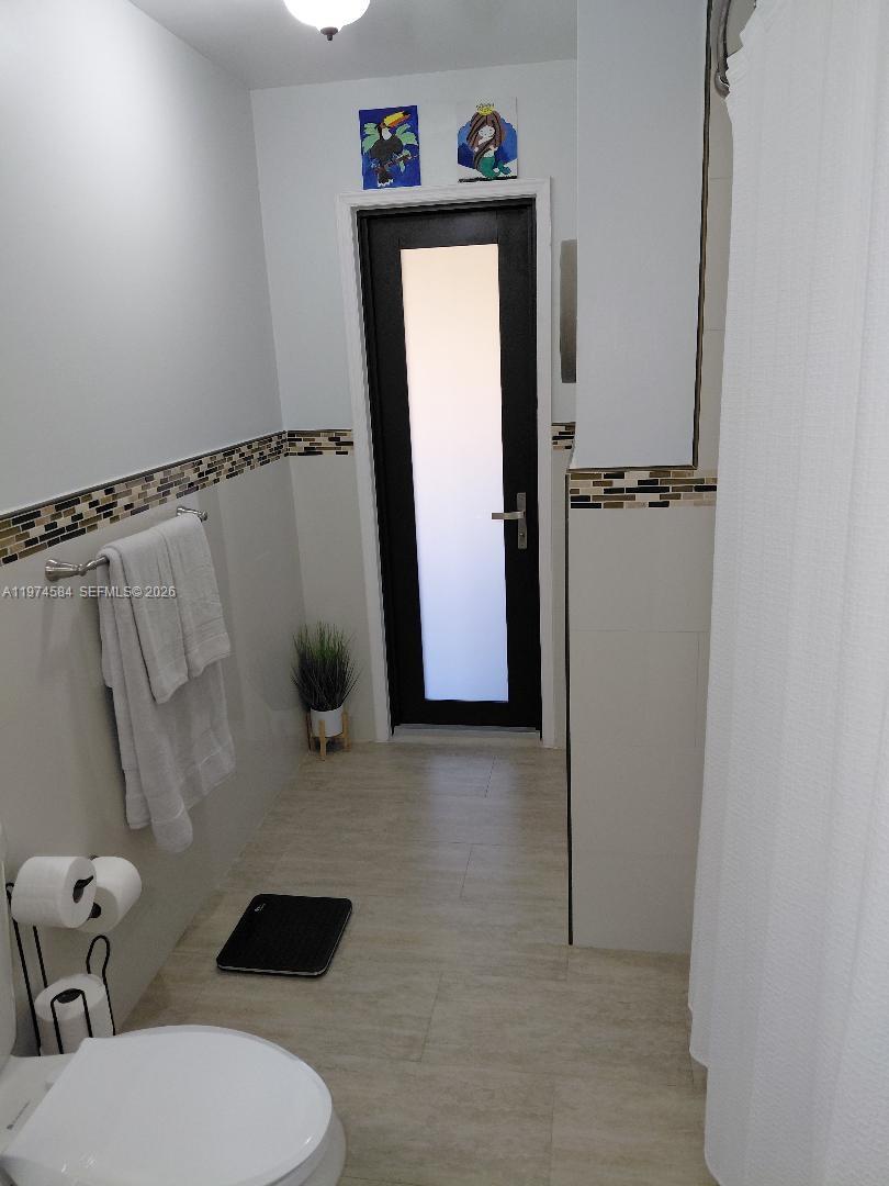 15630 Southwest 146th Avenue Miami, FL 33177 - Photo 23 of 23 a bathroom with a toilet and a shower
