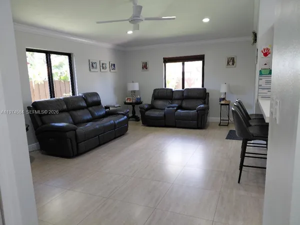 a living room with furniture and a window