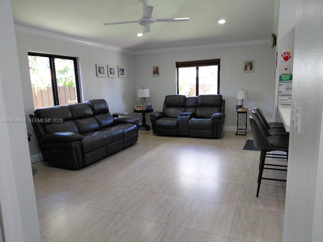 15630 Southwest 146th Avenue Miami, FL 33177 - Photo 4 of 23 a living room with furniture and a window