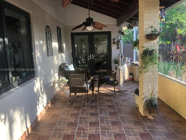 a view of a porch with chairs