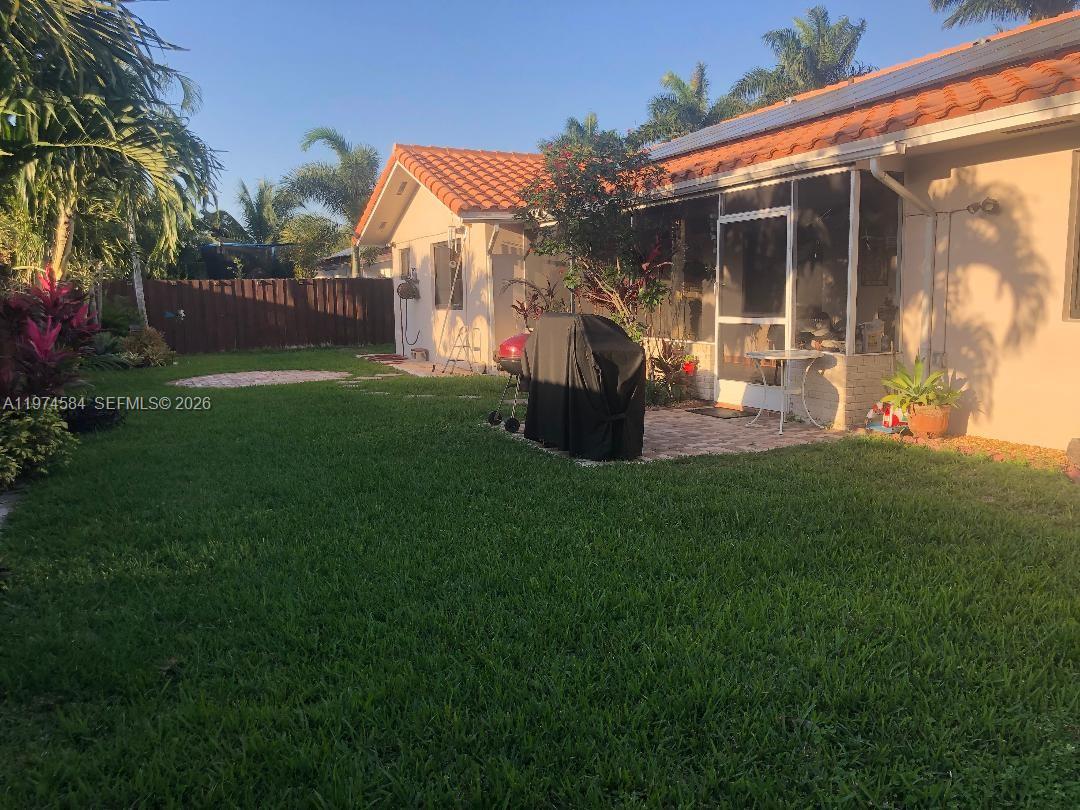 15630 Southwest 146th Avenue Miami, FL 33177 - Photo 10 of 23 a front view of house with garden