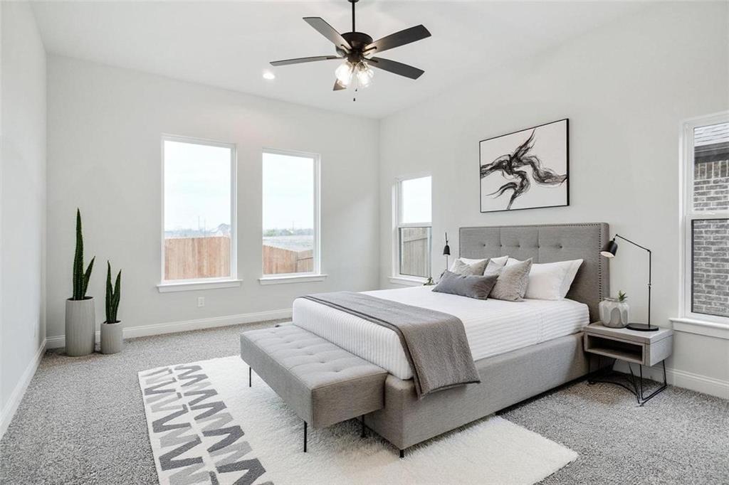 117 Sammy Street Godley, TX 76044 - Photo 10 of 27 a bedroom with a bed couch and window